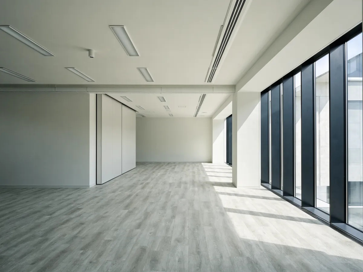 Glue-down commercial vinyl plank flooring in an open office interior