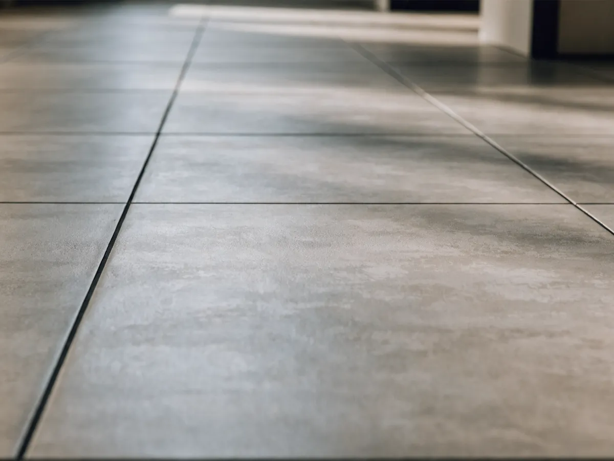 Large format porcelain floor tile laid with narrow grout joints